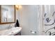 Updated bathroom featuring a modern sink, a toilet, and a shower with a decorative curtain at 1765 7Th St, Sarasota, FL 34236