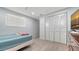 Comfortable bedroom with tile floors, a built-in closet, and a large window at 1765 7Th St, Sarasota, FL 34236