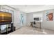 The bedroom features tile floors, a large window, and a door to the backyard at 1765 7Th St, Sarasota, FL 34236