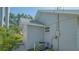 Exterior shot featuring the side of the home and its light grey siding and white trim at 1765 7Th St, Sarasota, FL 34236
