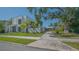 Exterior view of modern and cozy homes with palm trees and inviting curb appeal at 1765 7Th St, Sarasota, FL 34236