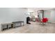 Open living space featuring wood floors, a modern kitchen, and a dining area with seating for four at 1765 7Th St, Sarasota, FL 34236