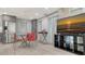 Bright and airy living room features tile floors, stainless steel appliances, and modern decor at 1765 7Th St, Sarasota, FL 34236
