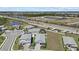 An aerial view showcasing the home's location within a community near a highway and scenic lakes at 17676 Savory Mist Cir, Bradenton, FL 34211