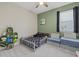 Inviting bedroom with playful decor, a cozy toddler bed, and ample space at 17676 Savory Mist Cir, Bradenton, FL 34211