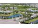 Community entrance with elegant signage surrounded by ponds and palm trees creates a welcoming atmosphere at 17676 Savory Mist Cir, Bradenton, FL 34211