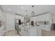 Well-equipped kitchen with stainless steel appliances, a spacious center island, and ample cabinet space at 17676 Savory Mist Cir, Bradenton, FL 34211