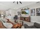 Living room features a large screen TV, wooden console, and comfortable seating for a relaxing entertainment space at 17676 Savory Mist Cir, Bradenton, FL 34211