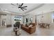 Inviting living room with natural light, stylish furniture, and an open layout for comfortable living at 17676 Savory Mist Cir, Bradenton, FL 34211