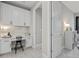 Bright office with a built-in desk, cabinets, and sleek modern design at 17676 Savory Mist Cir, Bradenton, FL 34211