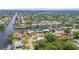 Breathtaking aerial view of a coastal community with waterfront homes and winding canals at 18399 Burkholder Cir, Port Charlotte, FL 33948