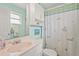 Bright bathroom featuring a combined shower and tub with a patterned shower curtain and mirrored vanity at 18399 Burkholder Cir, Port Charlotte, FL 33948