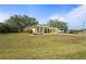 Beautiful yellow single-story home on a well maintained lawn at 18399 Burkholder Cir, Port Charlotte, FL 33948