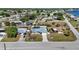 Beautiful home with a pool in a fenced backyard with other houses nearby at 19990 Midway Blvd, Port Charlotte, FL 33948