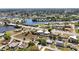 Scenic aerial view showcases homes near a serene river, blending residential living with natural beauty at 19990 Midway Blvd, Port Charlotte, FL 33948