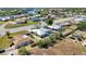 This aerial view highlights a home with a screened-in pool and a perfectly sized backyard perfect for outdoor enjoyment at 19990 Midway Blvd, Port Charlotte, FL 33948