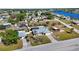 Aerial view of the property, showcasing a screened-in pool, a large backyard, and proximity to the water at 19990 Midway Blvd, Port Charlotte, FL 33948