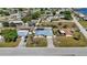 Birds-eye view of the residence with a screened-in pool and a large backyard at 19990 Midway Blvd, Port Charlotte, FL 33948
