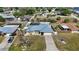 Beautiful home with a pool in a fenced backyard with other houses nearby at 19990 Midway Blvd, Port Charlotte, FL 33948
