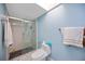 Bright bathroom with a glass-enclosed shower and a skylight at 19990 Midway Blvd, Port Charlotte, FL 33948