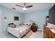 Bedroom featuring light blue walls, marble floors, a ceiling fan, and lots of room at 19990 Midway Blvd, Port Charlotte, FL 33948