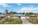 Charming single-story home with a well-manicured front yard and a two-car garage at 19990 Midway Blvd, Port Charlotte, FL 33948