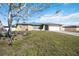 Nice home with a two-car garage and a lovely yard at 19990 Midway Blvd, Port Charlotte, FL 33948