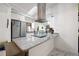 Bright kitchen showcasing granite countertops, white cabinetry, and stainless steel appliances at 19990 Midway Blvd, Port Charlotte, FL 33948