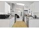 Modern kitchen featuring stainless steel appliances, granite countertops, and ample cabinet space at 19990 Midway Blvd, Port Charlotte, FL 33948