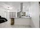 Open kitchen features a peninsula with granite countertops, stainless appliances, and lots of light at 19990 Midway Blvd, Port Charlotte, FL 33948