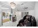 Bright, open living room with marble floors, chandelier and view of the modern kitchen at 19990 Midway Blvd, Port Charlotte, FL 33948