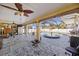 Covered outdoor patio featuring an attached pool, spa, and ceiling fan at 19990 Midway Blvd, Port Charlotte, FL 33948