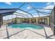 Relaxing screened-in pool area features a heated pool and spa at 19990 Midway Blvd, Port Charlotte, FL 33948