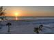 Sunset on the beach, showing a tranquil scene and beautiful colors reflecting on the sand and water at 20 Whispering Sands Dr # 406, Sarasota, FL 34242