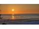 Beautiful beach sunset at this property, with people enjoying the golden hour and calm ocean views at 20 Whispering Sands Dr # 406, Sarasota, FL 34242