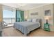 Bright bedroom with ocean view, comfortable queen bed, and inviting coastal decor at 20 Whispering Sands Dr # 406, Sarasota, FL 34242