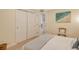 Bright bedroom featuring a double door closet and neutral decor at 20 Whispering Sands Dr # 406, Sarasota, FL 34242