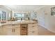 Spacious open concept kitchen with island, wine cooler and lovely living space at 20 Whispering Sands Dr # 406, Sarasota, FL 34242