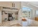 Bright kitchen area with granite countertops, coffee machine, and lovely outside views at 20 Whispering Sands Dr # 406, Sarasota, FL 34242