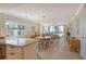 Bright living room with an open-concept floor plan, hardwood floors, and an ocean view at 20 Whispering Sands Dr # 406, Sarasota, FL 34242