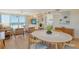 Open living space with modern lighting, wood floors, and scenic ocean views at 20 Whispering Sands Dr # 406, Sarasota, FL 34242