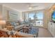 Inviting living room featuring hardwood floors, ocean views, and stylish furniture at 20 Whispering Sands Dr # 406, Sarasota, FL 34242