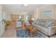 Bright, airy living room with stylish furnishings, an open layout, and views of the eat-in kitchen at 20 Whispering Sands Dr # 406, Sarasota, FL 34242