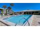 Bright and refreshing pool area with ample seating, perfect for relaxation and enjoyment under the sun at 20 Whispering Sands Dr # 406, Sarasota, FL 34242