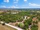 Expansive acreage featuring mature trees, a serene pond, and natural beauty at 22520 61St E Ave, Bradenton, FL 34211