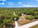 Serene acreage featuring mature trees, access road, and a tranquil pond at 22520 61St E Ave, Bradenton, FL 34211
