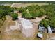 Expansive property featuring a foundation, mature trees, and a tranquil pond at 22520 61St E Ave, Bradenton, FL 34211