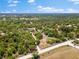 Picturesque acreage featuring mature trees, access road, and a tranquil pond at 22520 61St E Ave, Bradenton, FL 34211