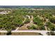 Expansive acreage featuring mature trees, a serene pond, and quiet street access at 22520 61St E Ave, Bradenton, FL 34211