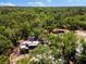 Aerial view of a treed lot with a mobile home at 22520 61St E Ave, Bradenton, FL 34211